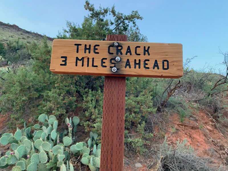A sign that says the crack 3 miles ahead