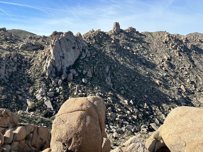 A view of Gardener's Wall and Tom's Thumb from the trail