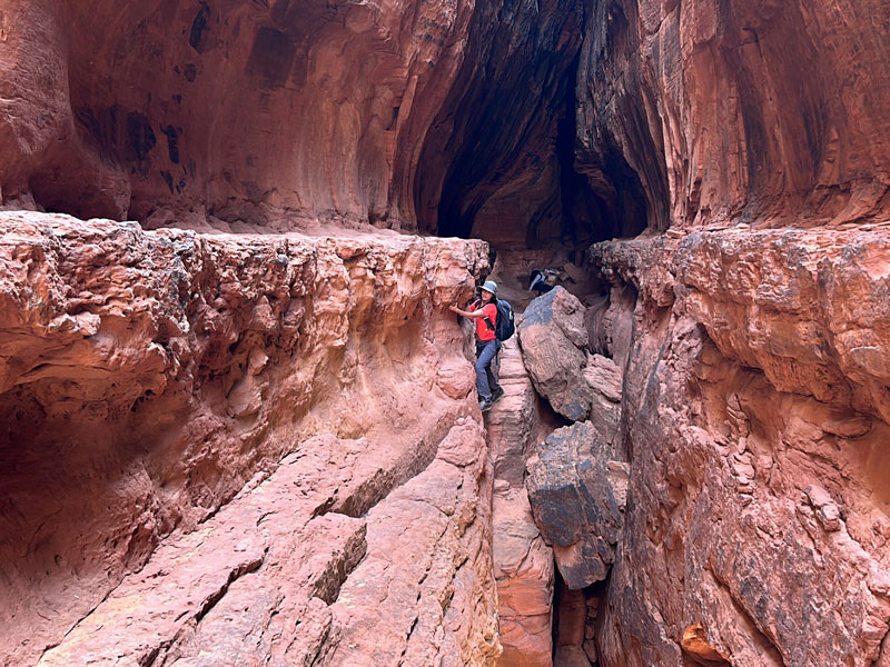 Walking the ledge in the Soldier Pass Cave