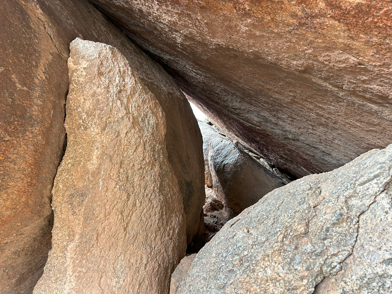 Going underneath Submarine Rock on the Marcus Landslide Trail