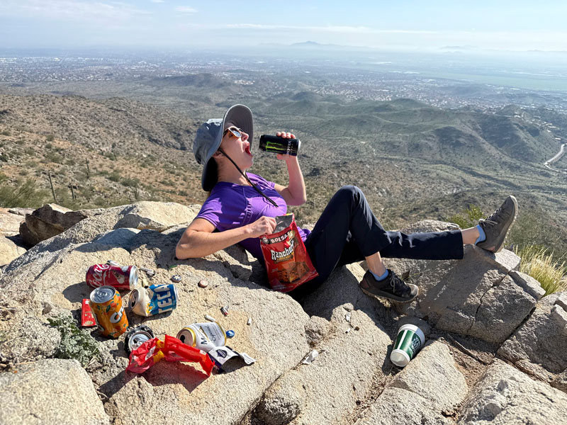April posing with trash at the Gila Valley Lookout